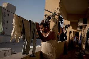 Quartier Industrial Area. De nombreux ouvriers vivent dans ces camps insalubres, aux portes de Doha.